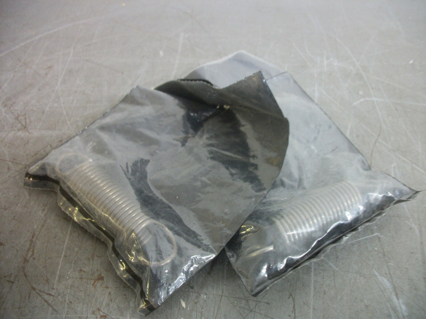 CAT LOT OF 2 SPRINGS 1036876 NEW